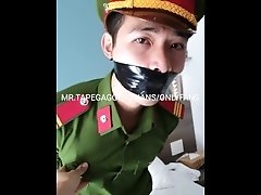 Vietnam police slave in uniform bound and tape gagged