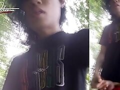 Jon Arteen walks in a gay cruising park, wanks, cums outdoors in front of water. Horny twink public
